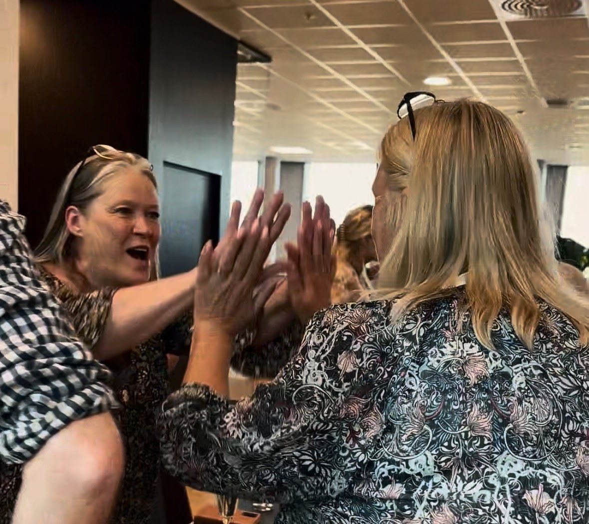 Two guests high-five