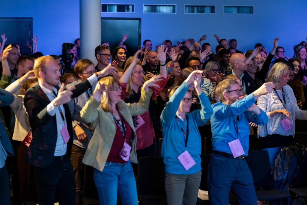 Conference audience dancing