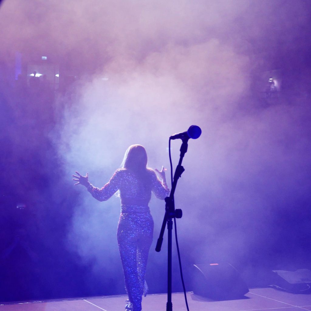 Silhouette in smoke and purple light