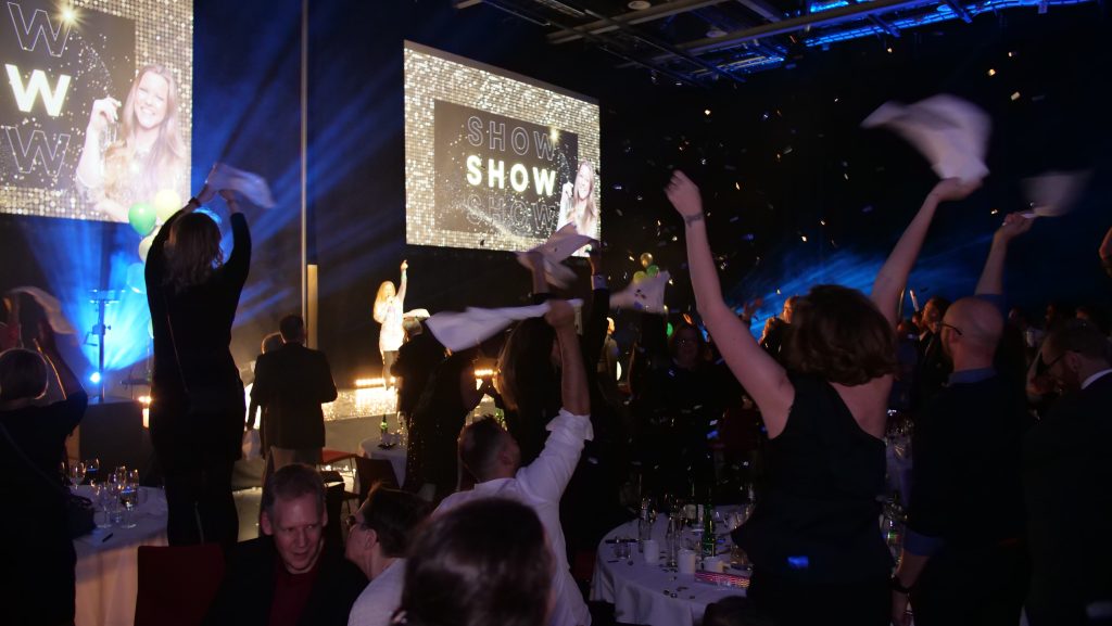 The audience waving napkins
